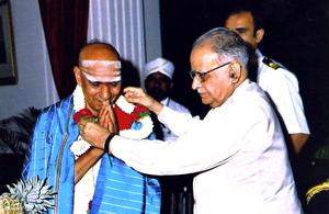 Vidwan Sharma being honoured by His Excellency T. N. Chaturvedi the Honourable Governor of Karnataka (2006)
